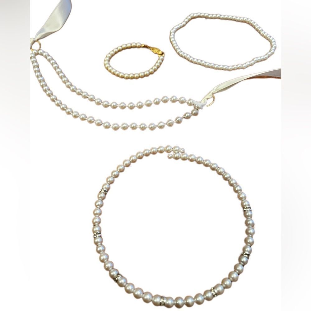 Set of 4, 3 girl’s necklaces and one bracelet. All faux pearl.